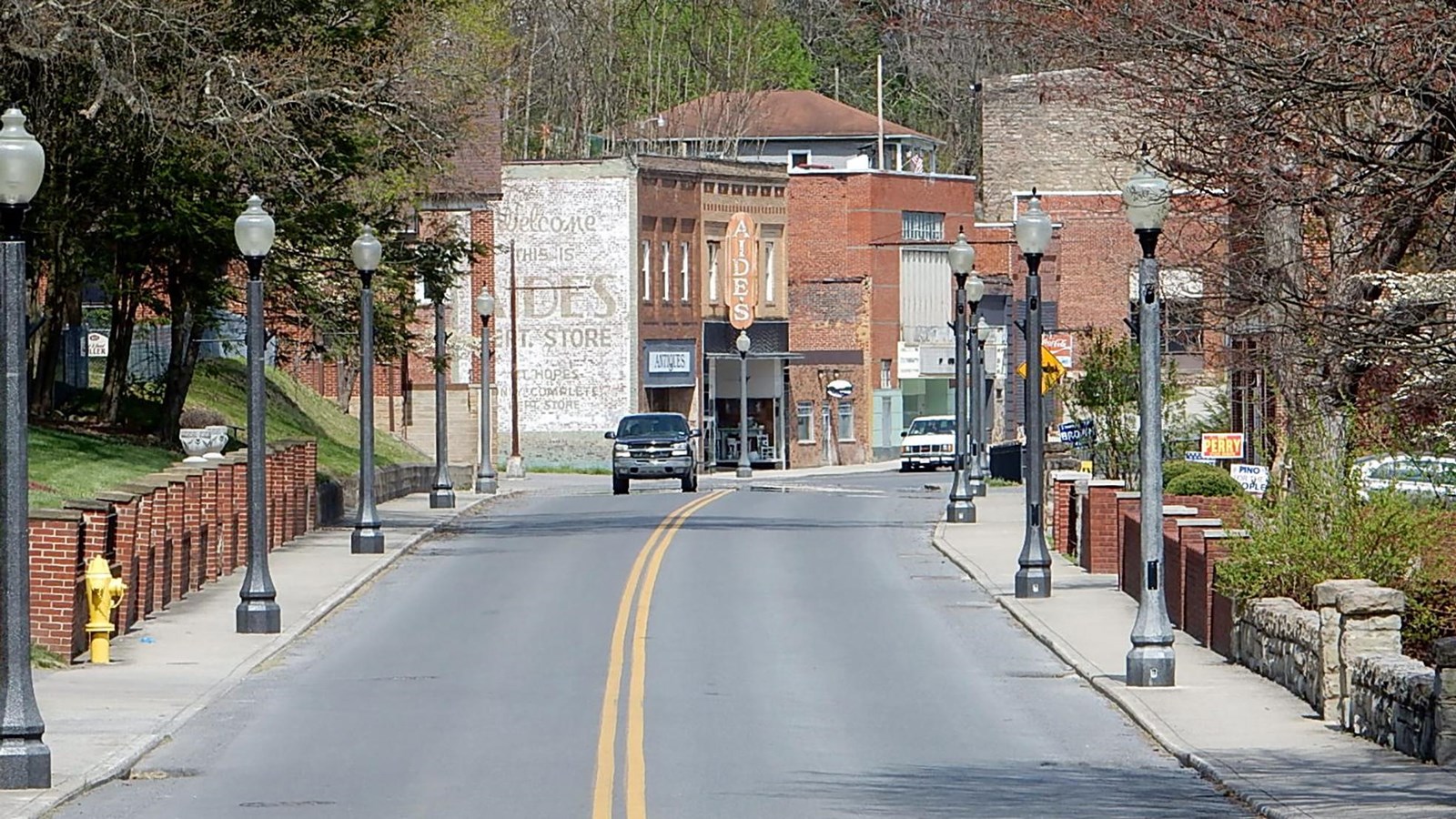 street running through downtown with brick buidlings