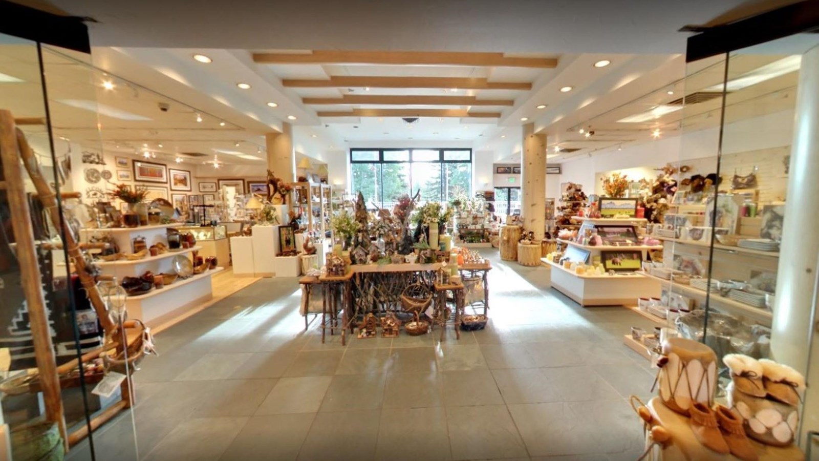 A large bright room full of souvenirs and housewares.