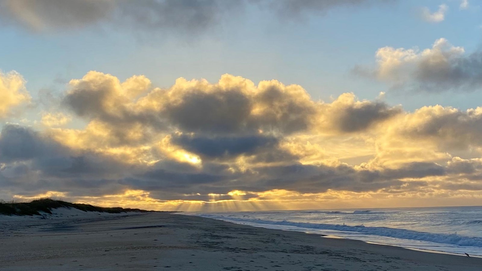 waves crashing on a sandy beach