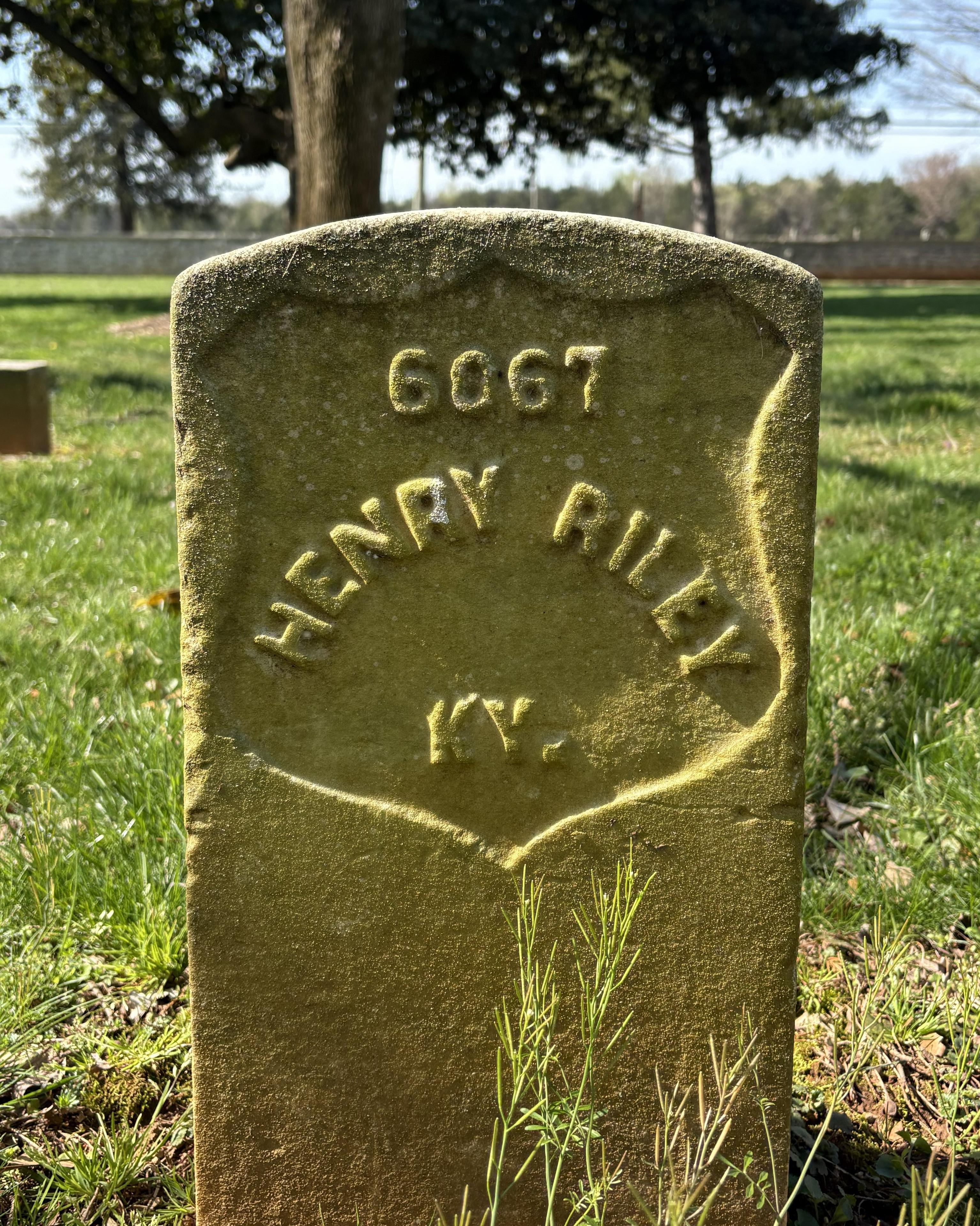 Marble headstone reading "Henry Riley KY." 