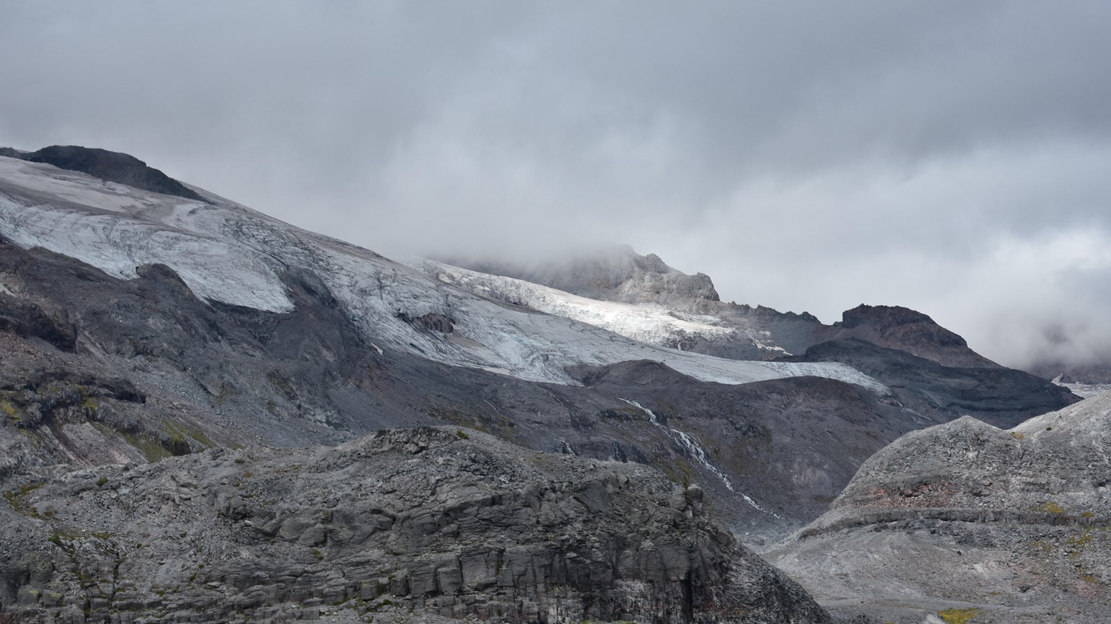 The Paradise-Stevens Glacier has retreated leaving behind a barren, rocky valley.