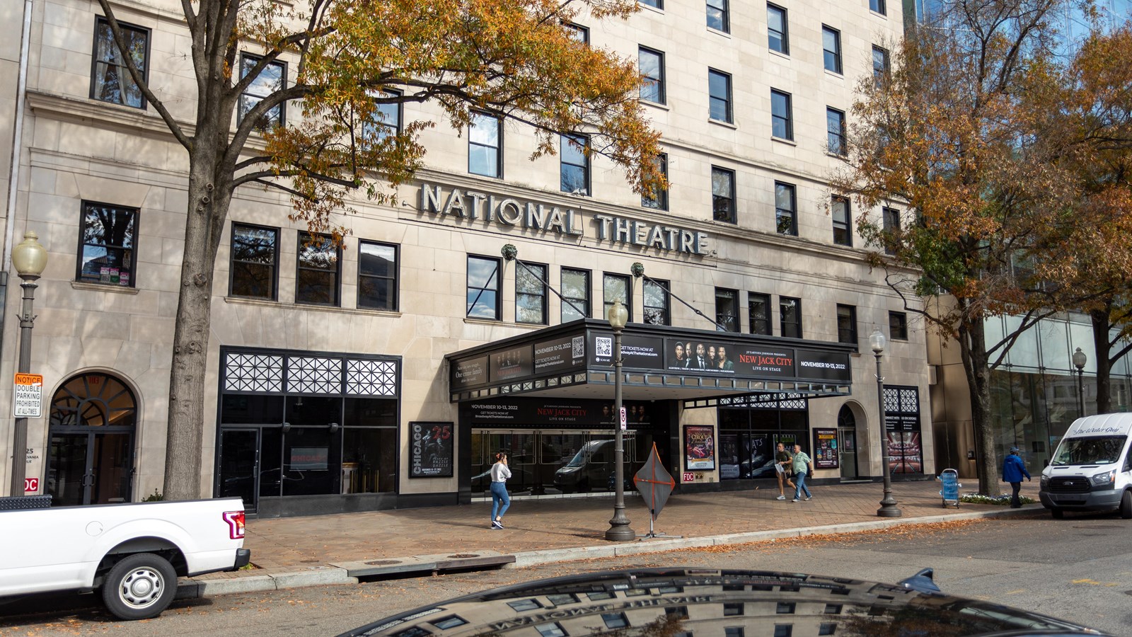A square awning hangs over the entrance of a building with 