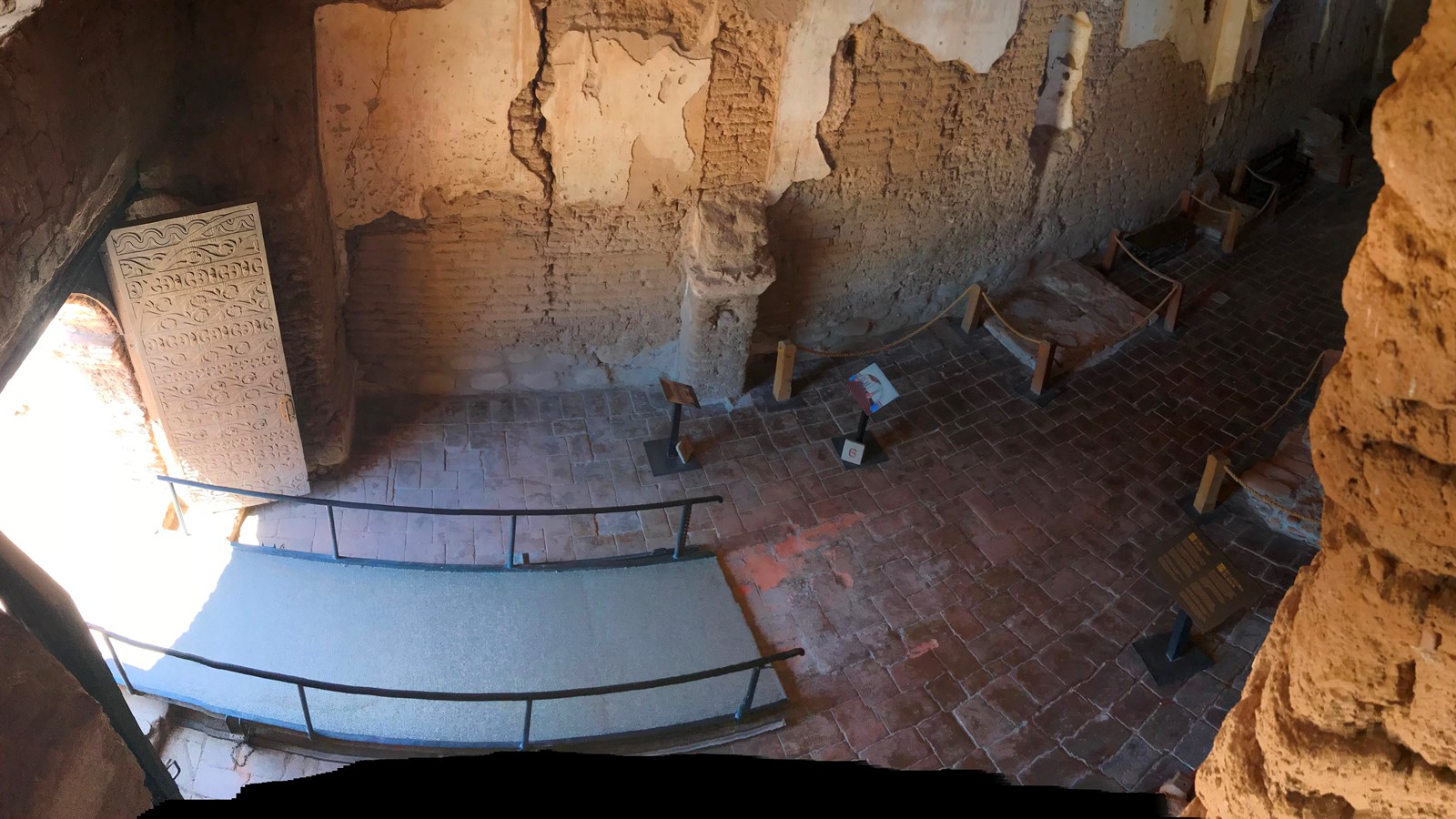 panoramic view looking down from upper story over front entrance
