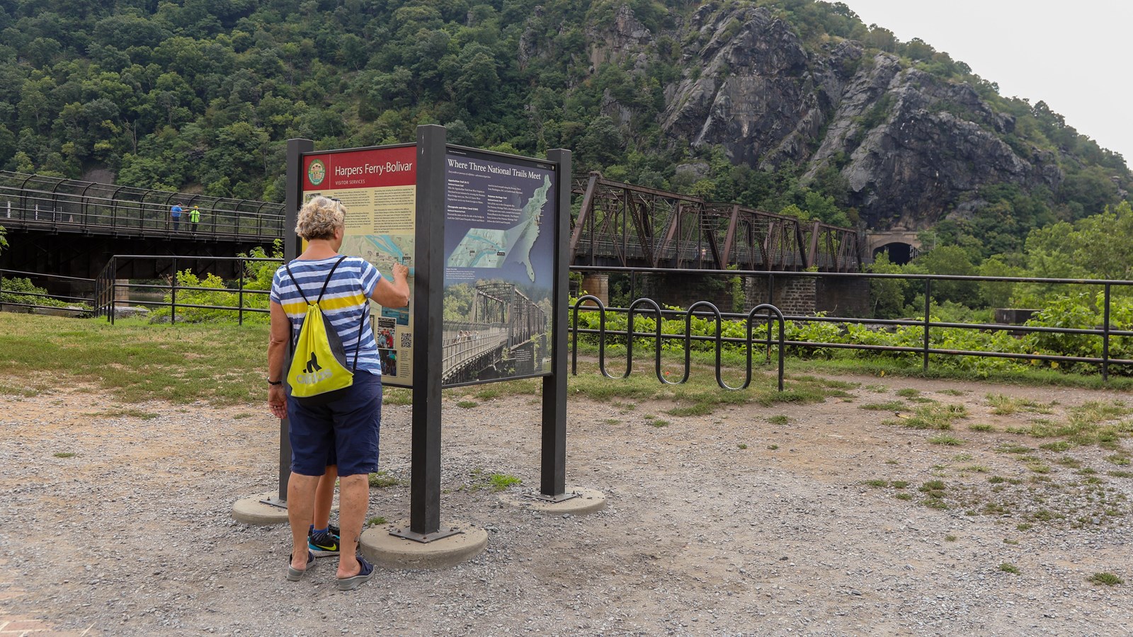 An exhibit panel shows an aerial view of Harpers Ferry and the rivers on either side.