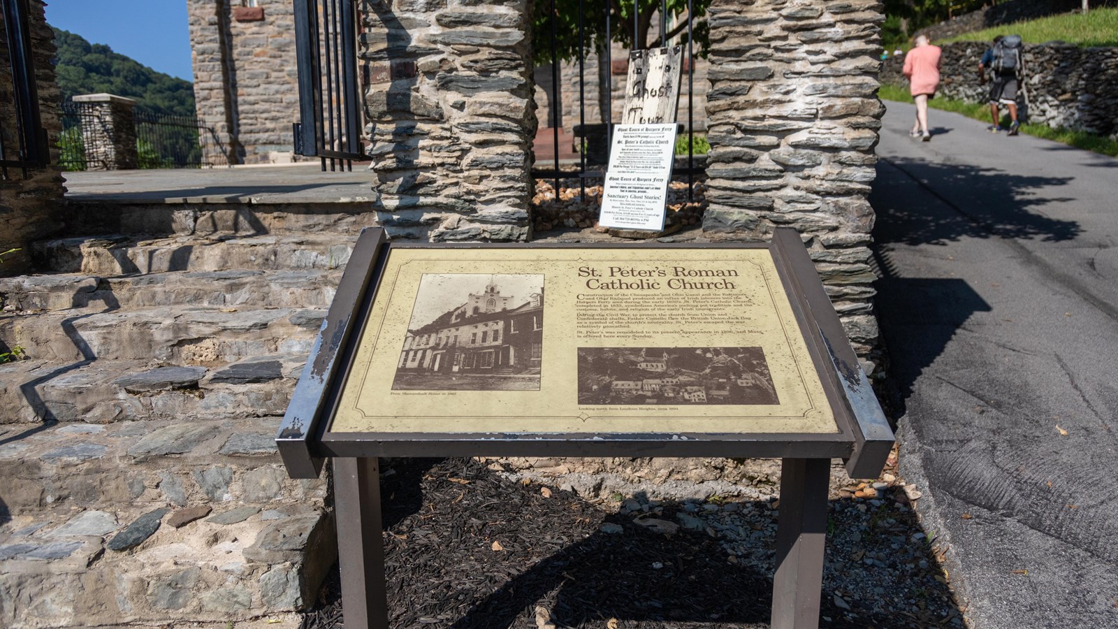 An exhibit panel with historic photos of a church and text 