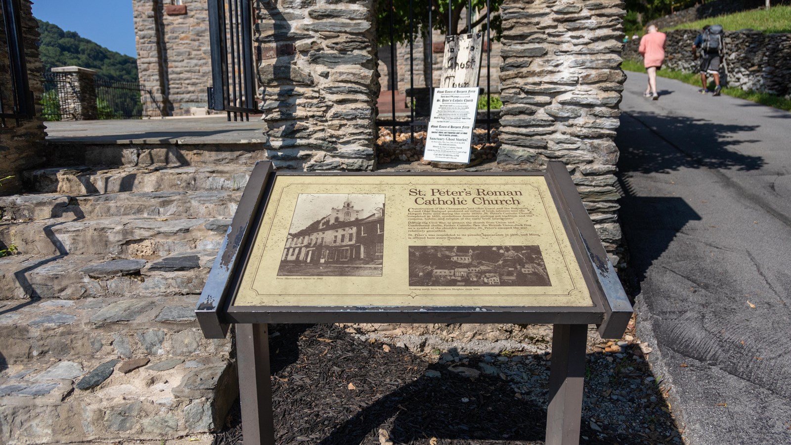 An exhibit panel with historic photos of a church and text 