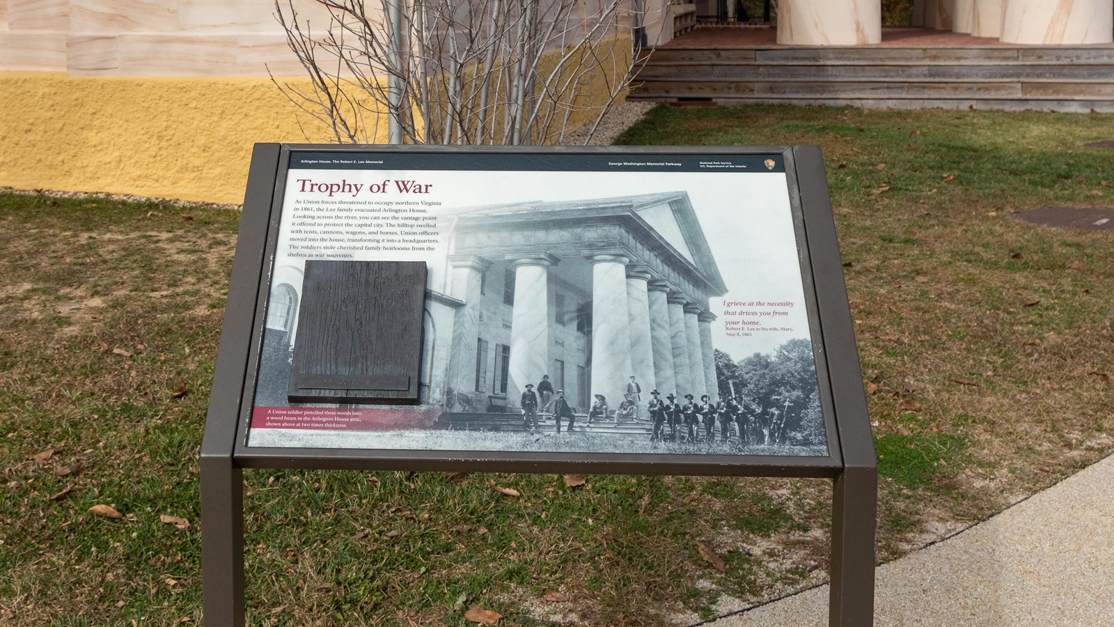An info panel with photo of soldiers with rifles in front of columns at Arlington House.