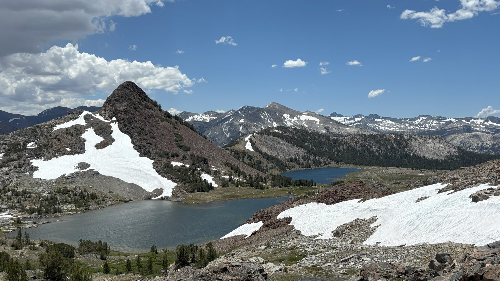 Two large lakes viewed from high above; peaks frame the lakes