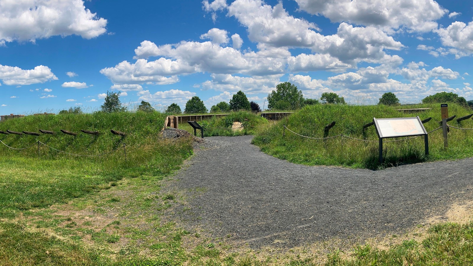 outdoors, photograph, grass, fort, cannon, gravel sign