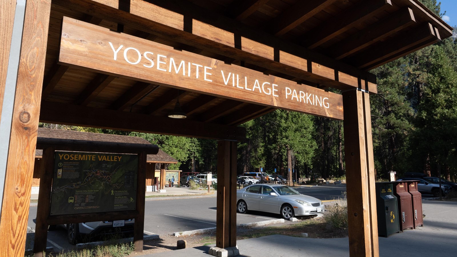 A covered shelter with a wood sign reading 