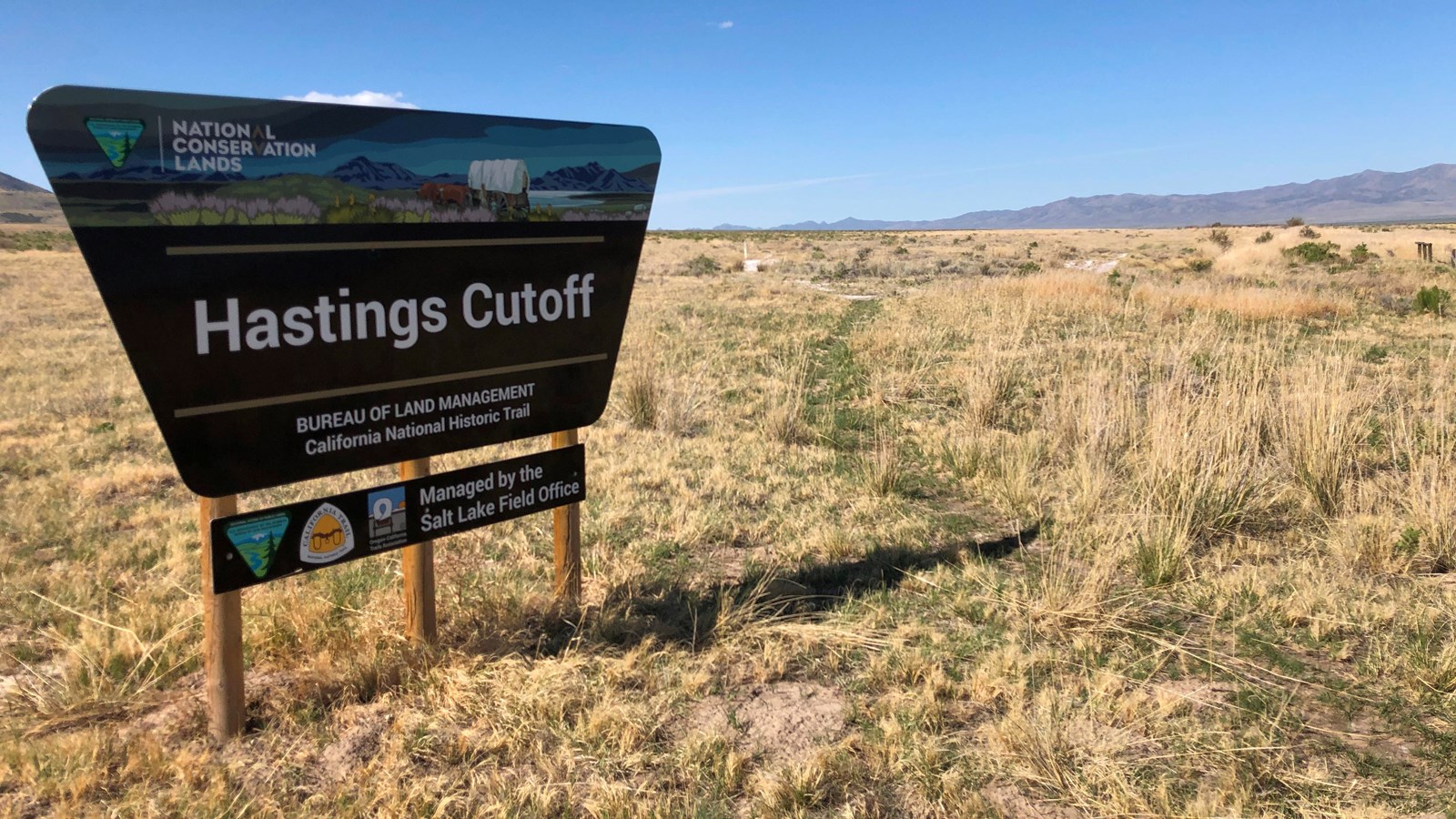 An entrance sign to the left saying, 