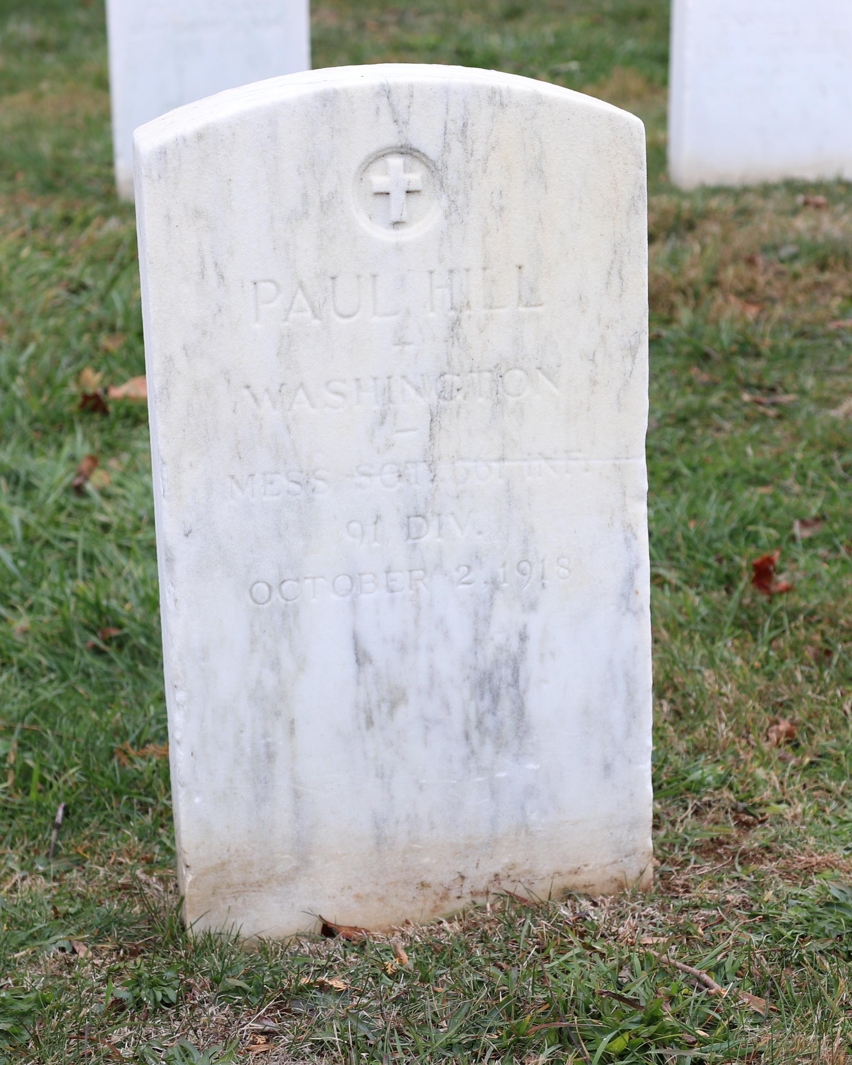The white headstone of Sgt. Paul Hill