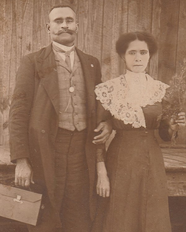 Man and woman pose for picture.
