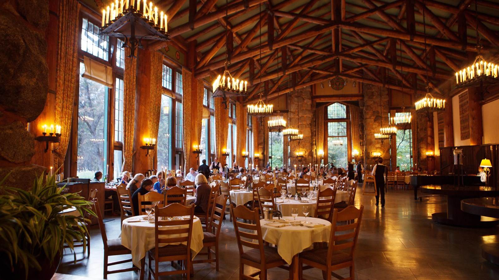 Tables and people dining in the dining room at The Ahwahnee