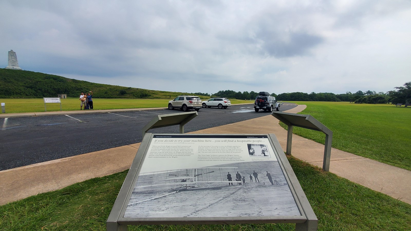 Colored photo of the wayside where it is located outside.