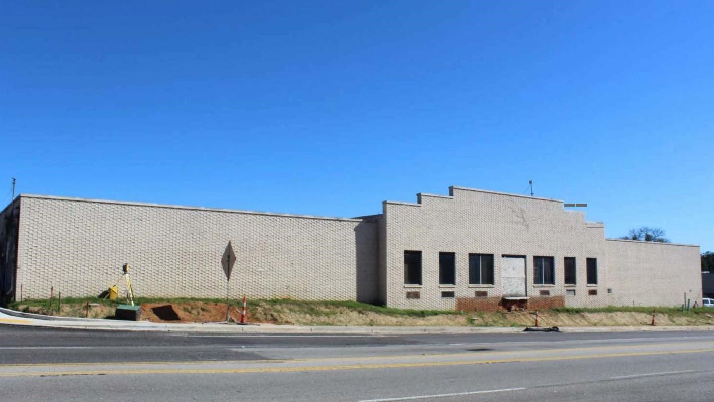 plain brick factor building facing the street 