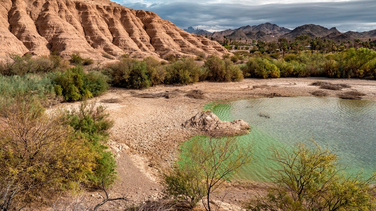 A cove next to a geologic formation.