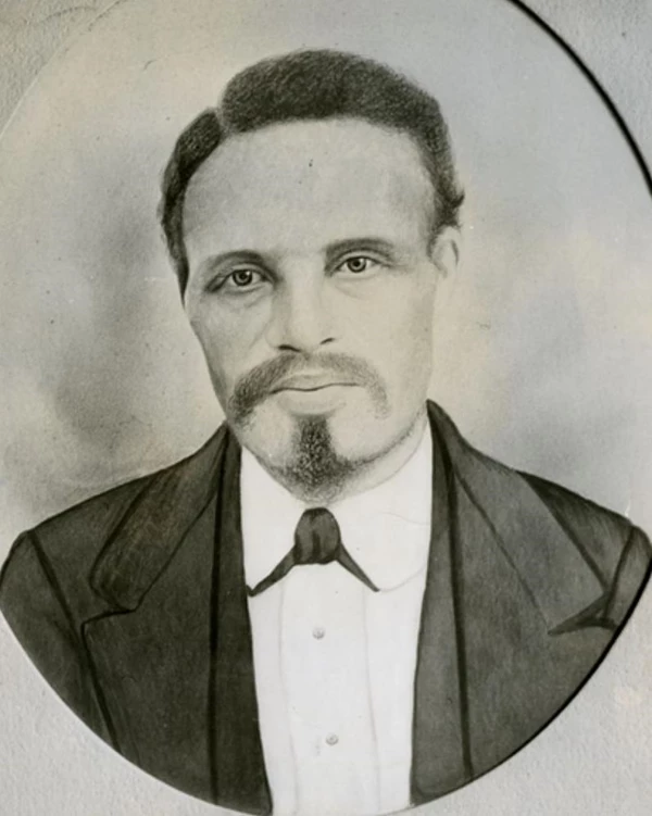 A black and white image of a man in a suit.