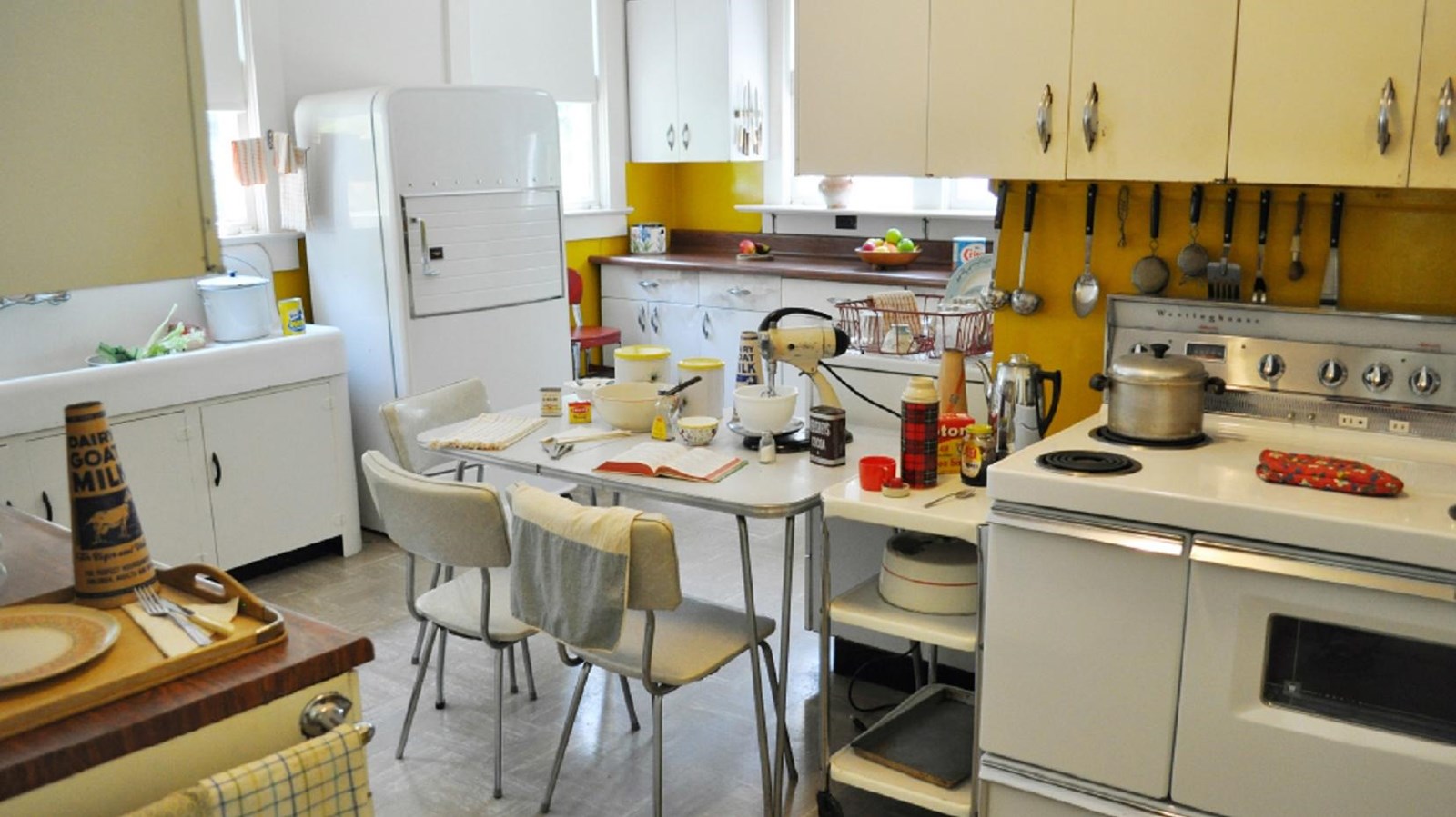 A vintage 1950\'s Kitchen with pie pantry, stove, two sinks, and