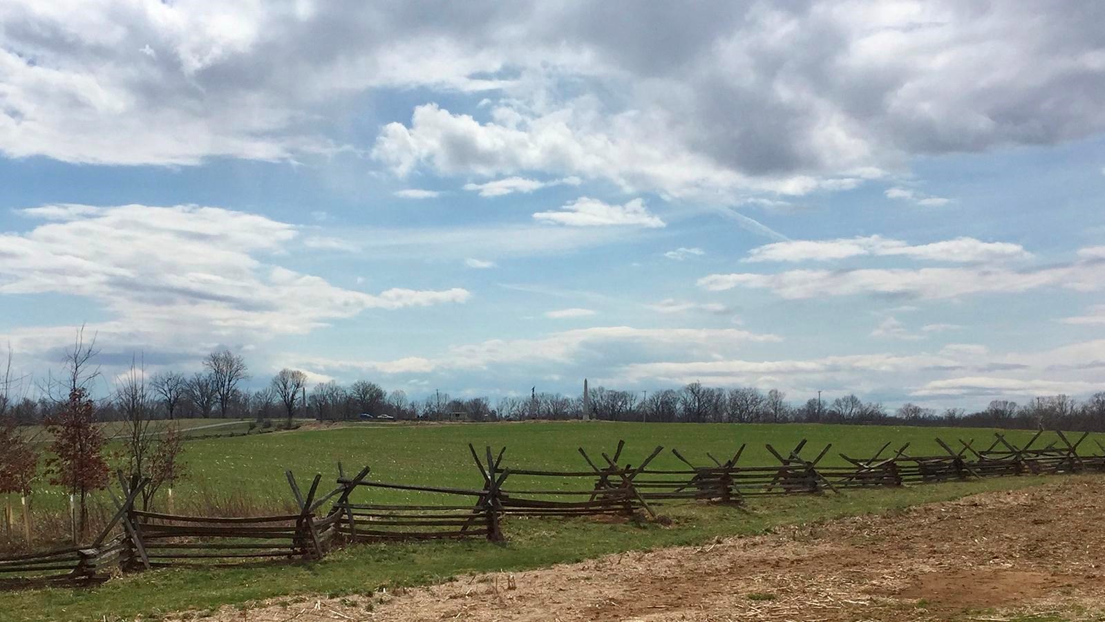 rail fence around a crop field