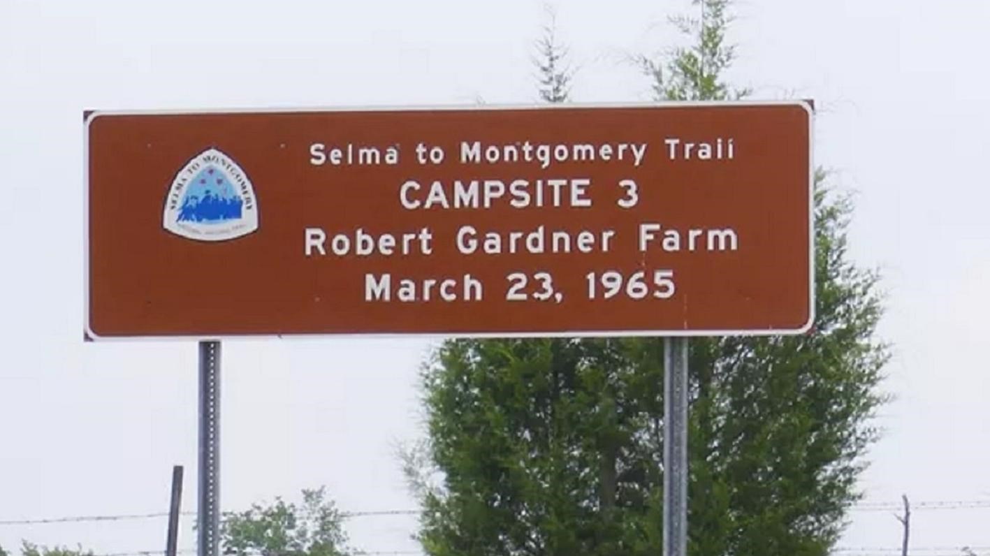 A brown sign which reads same as title.