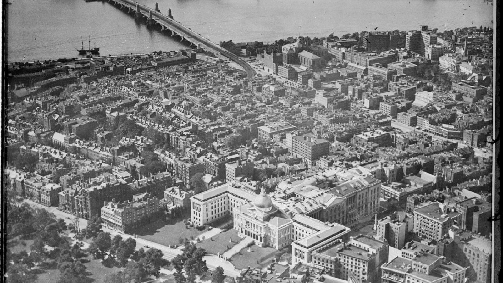 aerial shot of Beacon Hill with Boston Common & State House in the foreground towards Charles River.