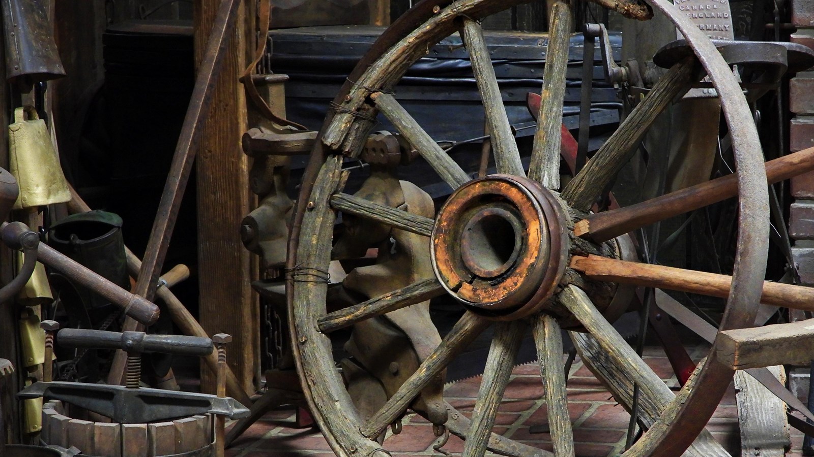 A historic wooden wagon wheel.