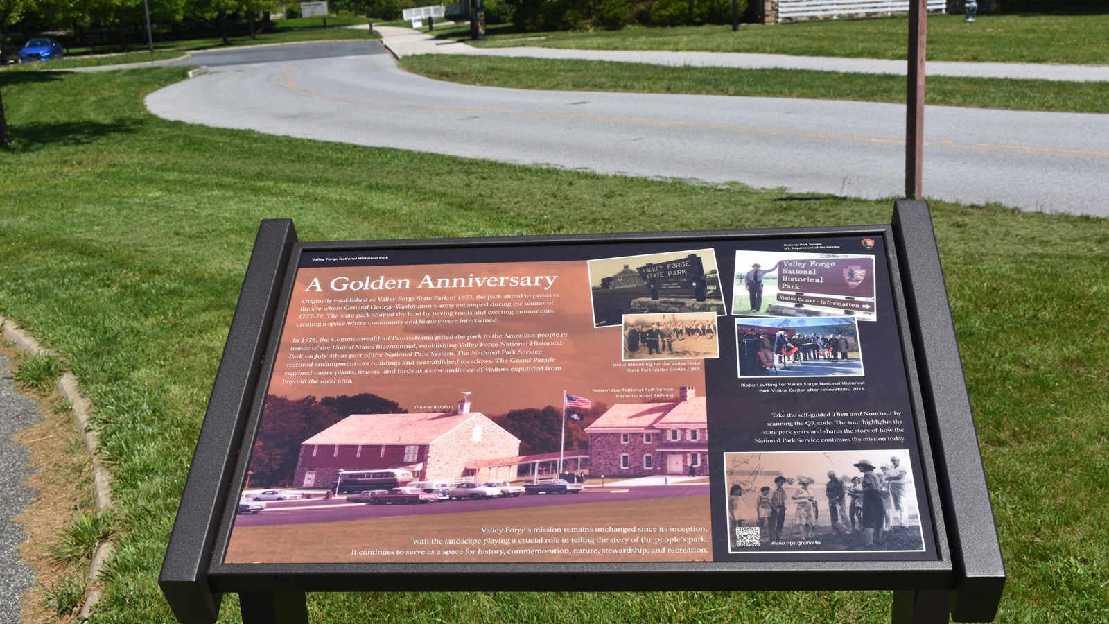 wayside panel featuring photos of the admin building from the 1960s and 70s to present day