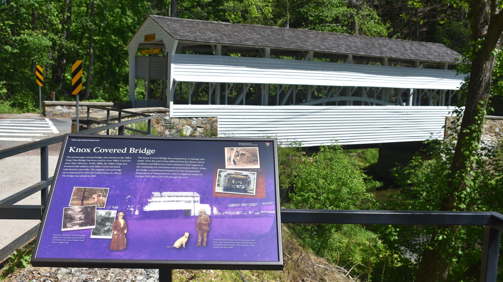 wayside exhibit featuring historic photos and postcards of the knox covered bridge, photos of damage