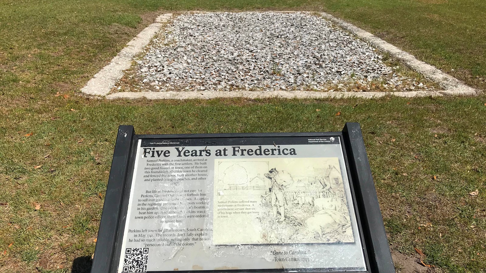 A wayside stands before a rectangular tabby concrete foundation and reads 