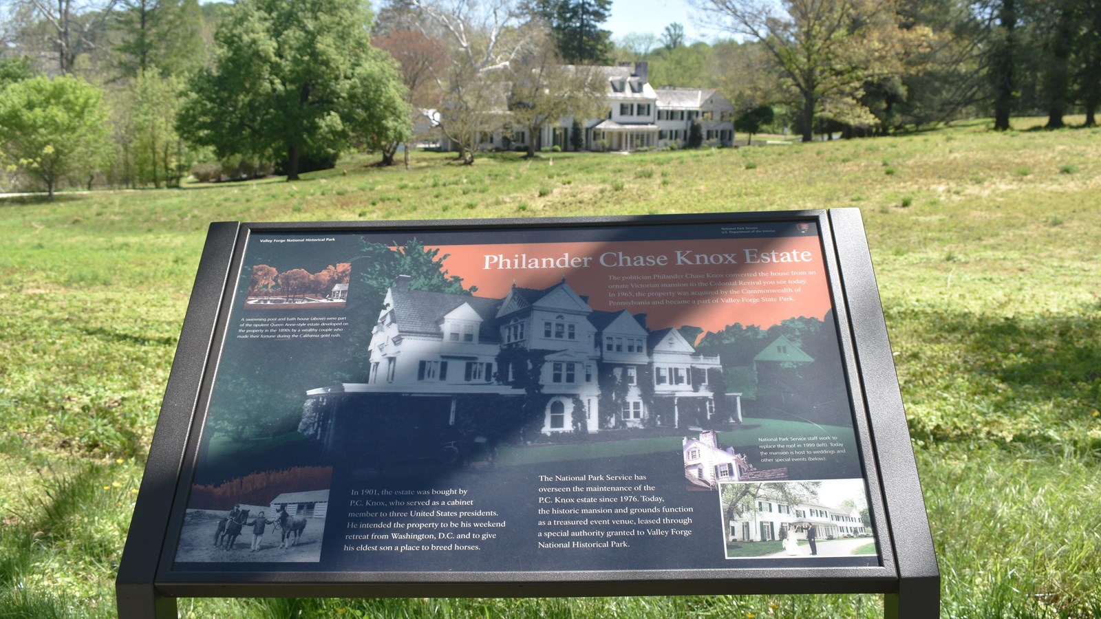 wayside exhibit panel with historic photographs of an ornate mansion
