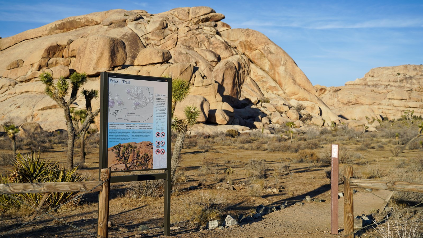 A trailhead sign reading 