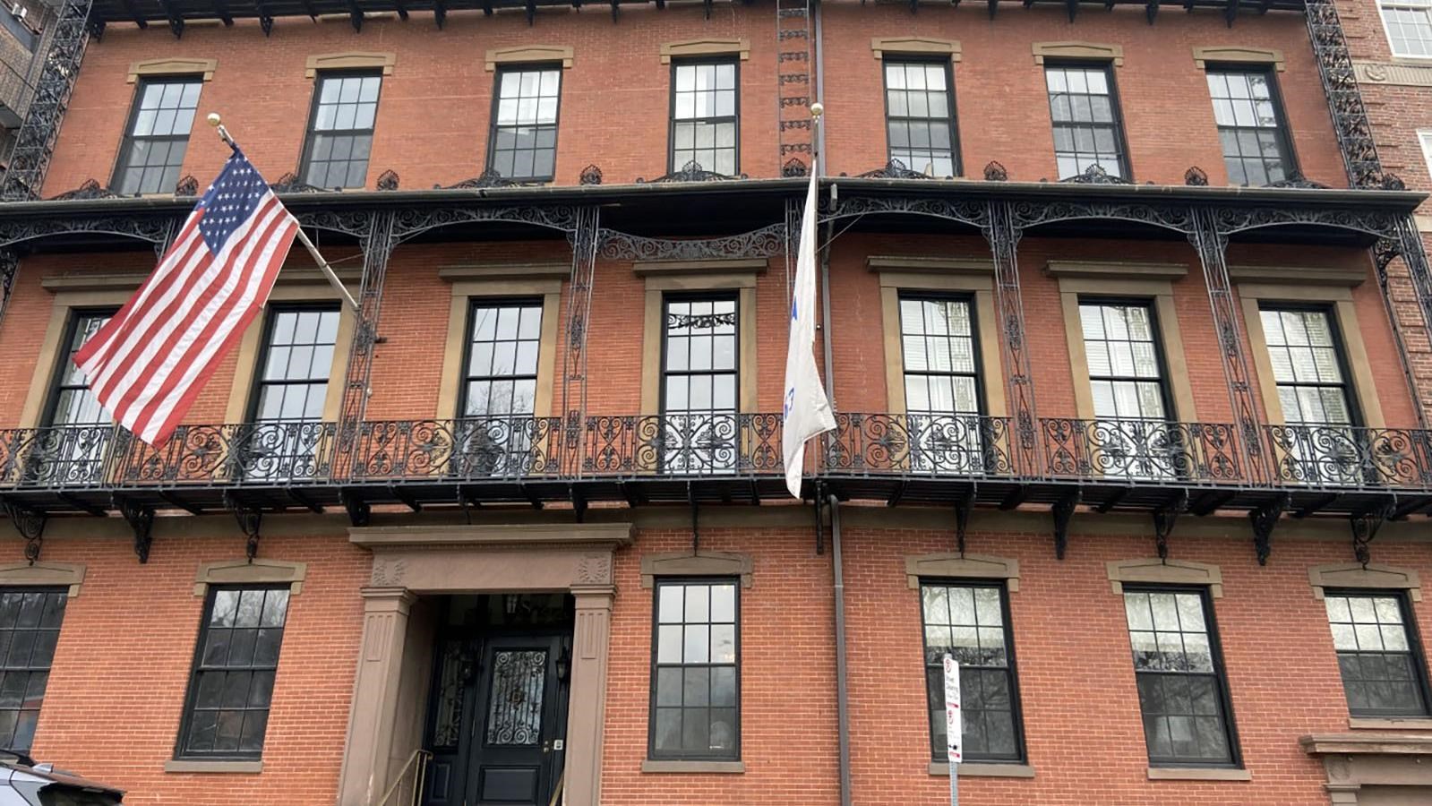 7a Park St is a 5 storied building with black railings across the windows on each floor.