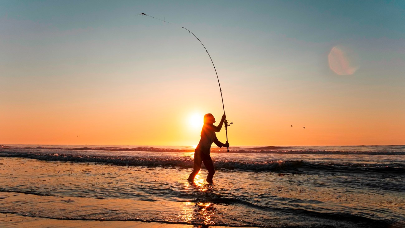 An angler on Assateague at sunrise