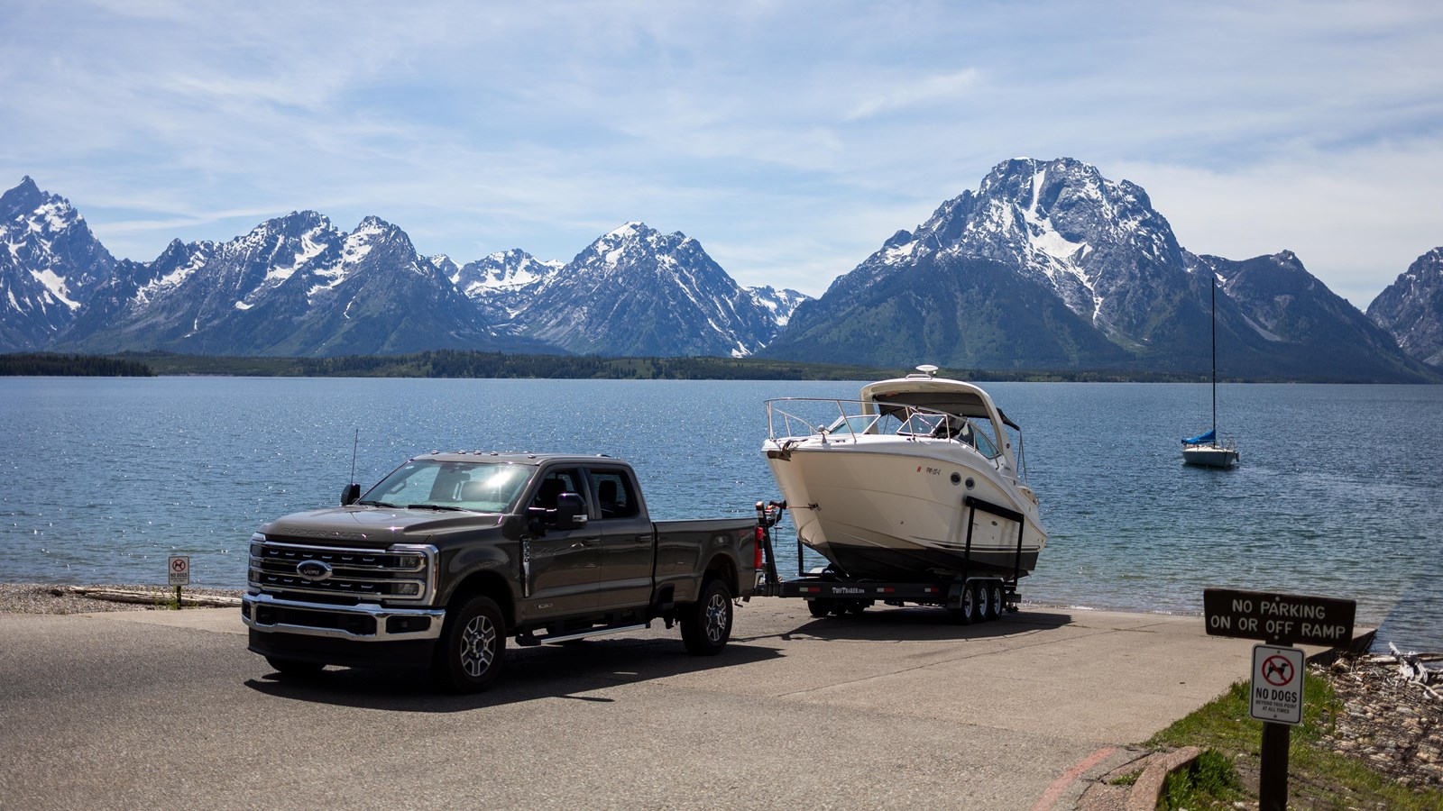 Vehicle towing boat prepares to leave.