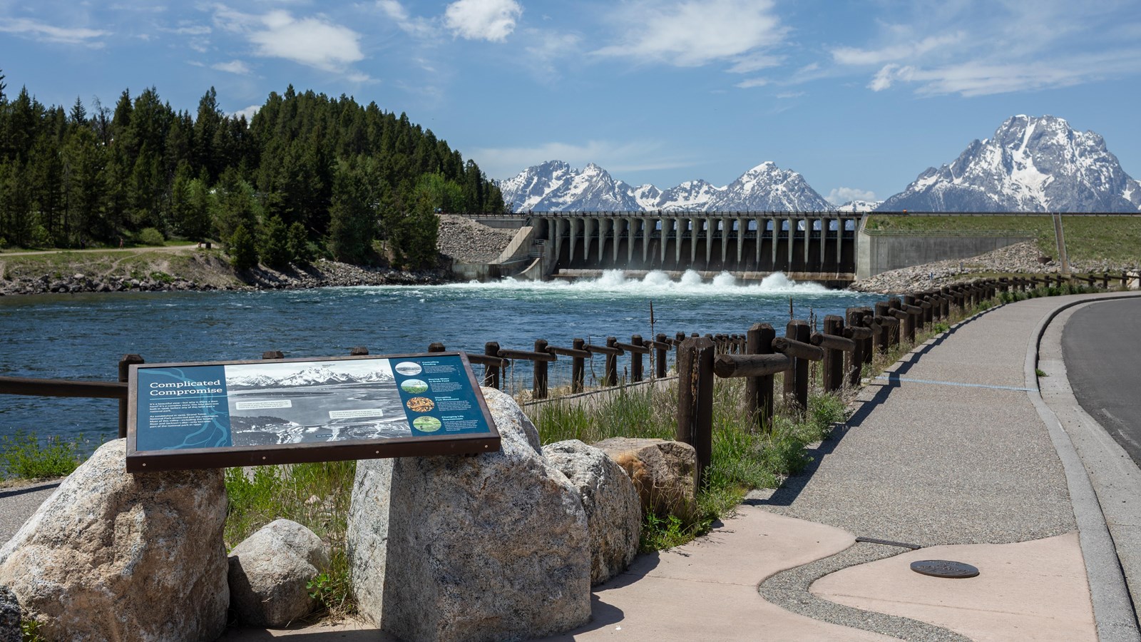 View point of Jackson Lake Dam with mountains in background.