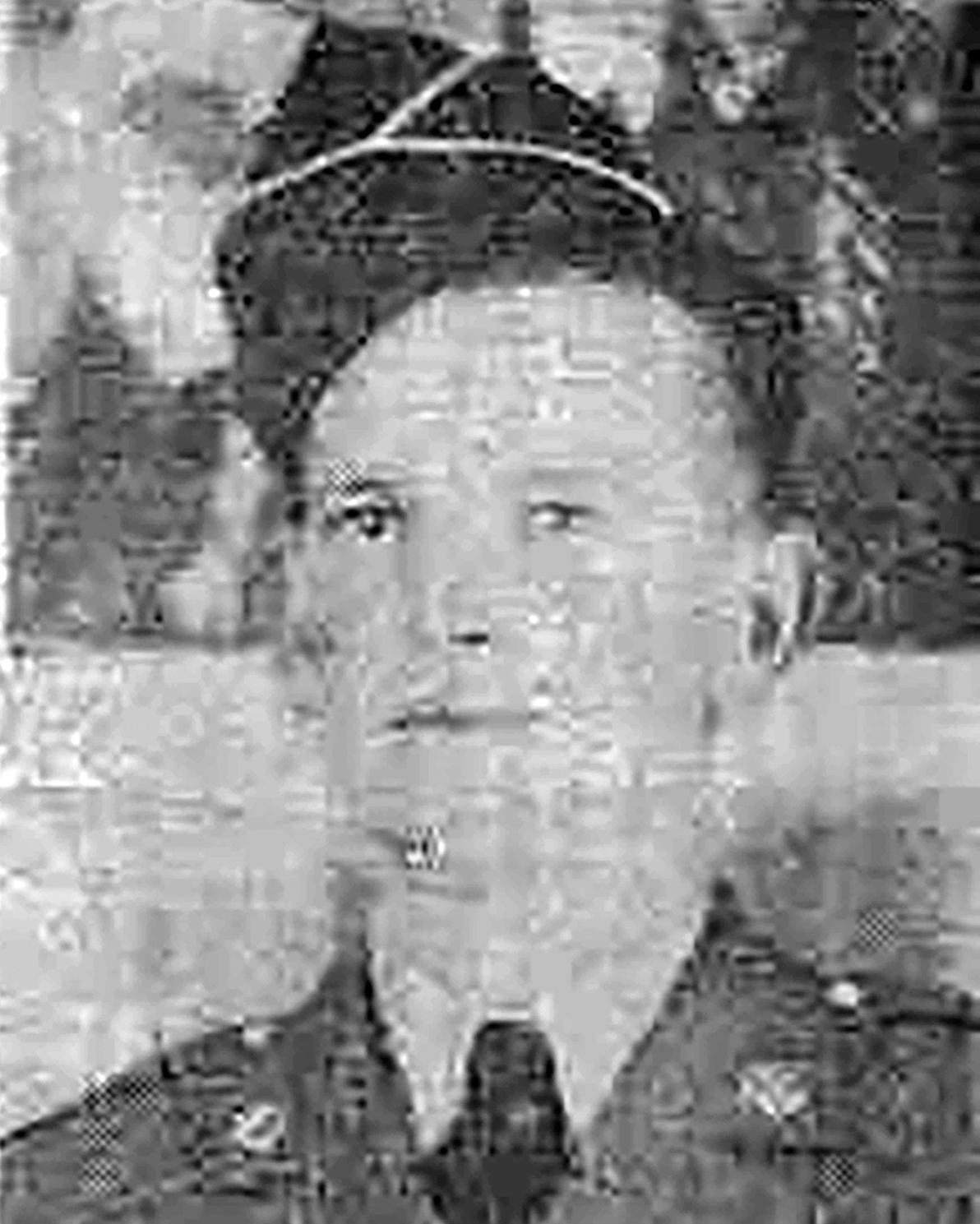 A young man wearing a World War II era U.S. Army uniform.