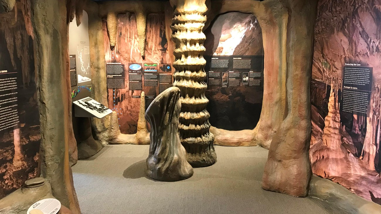 Tan model cave formations inside a visitor center