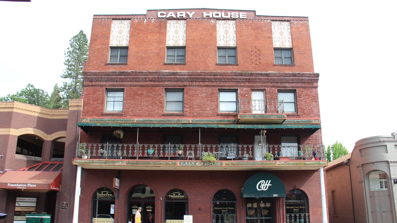 A large brick historic building with many windows.