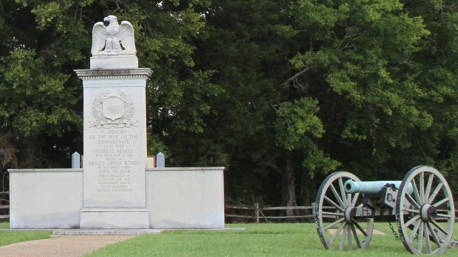 Granite monument with an eagle on the top commemorating the Battle of Brices Cross Roads