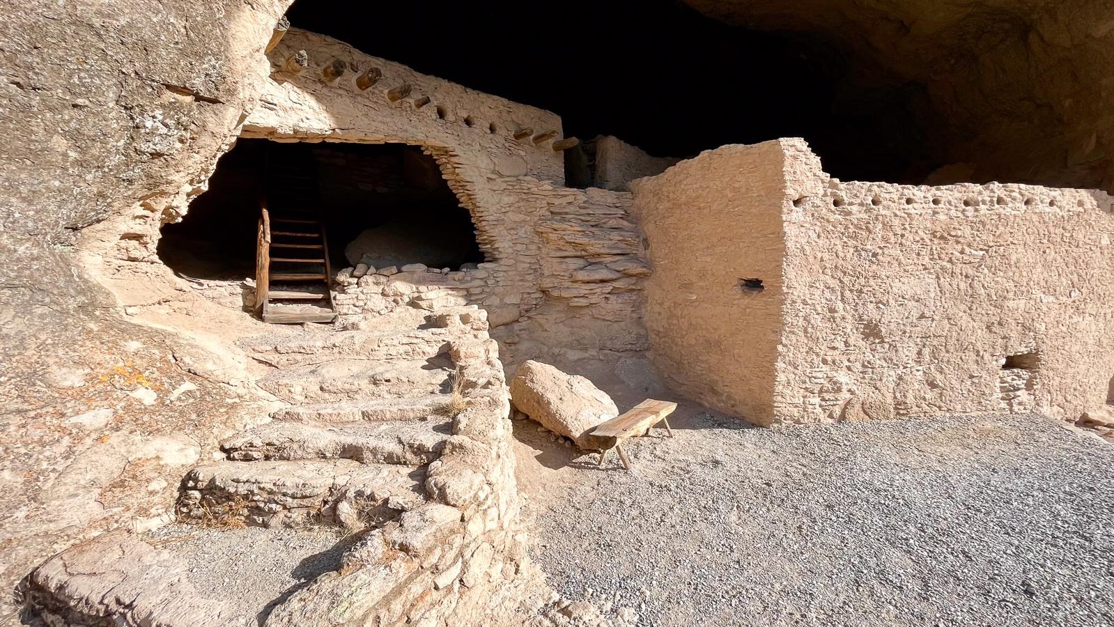 Stone building with a stone staircase leading up to it.