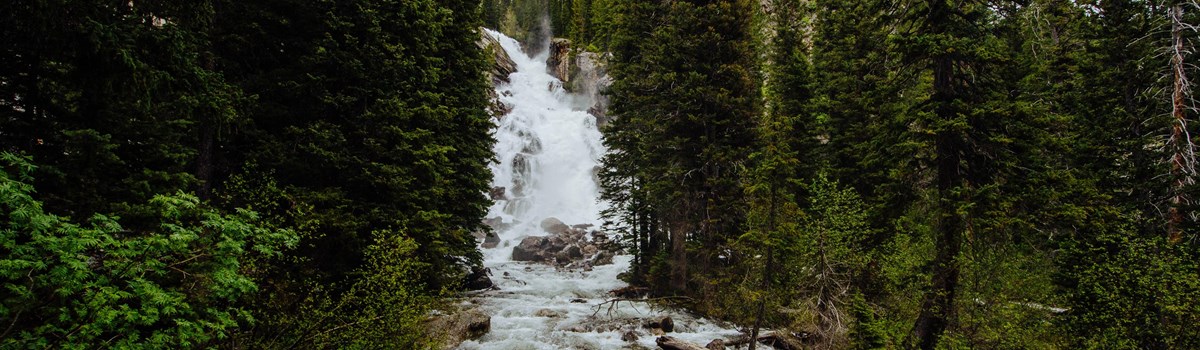 Water cascades down a 100ft waterfall.