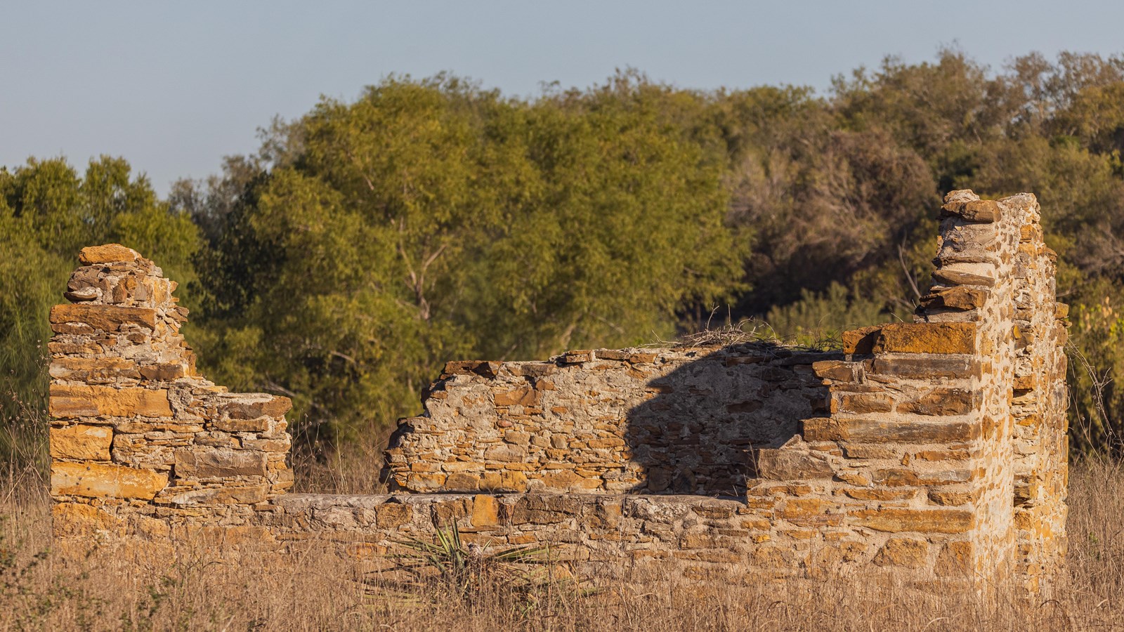 Stone ruins in a grass field