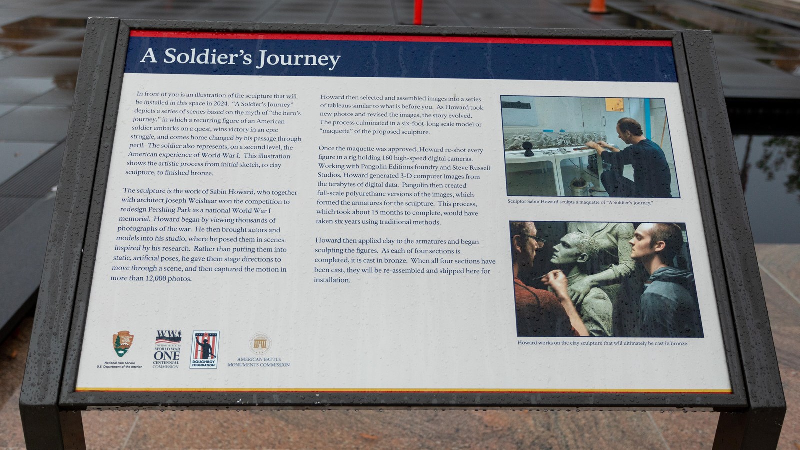 An angled information panel with images of a sculptor working.