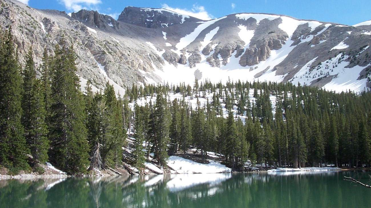 Alpine lake with mountain in the background