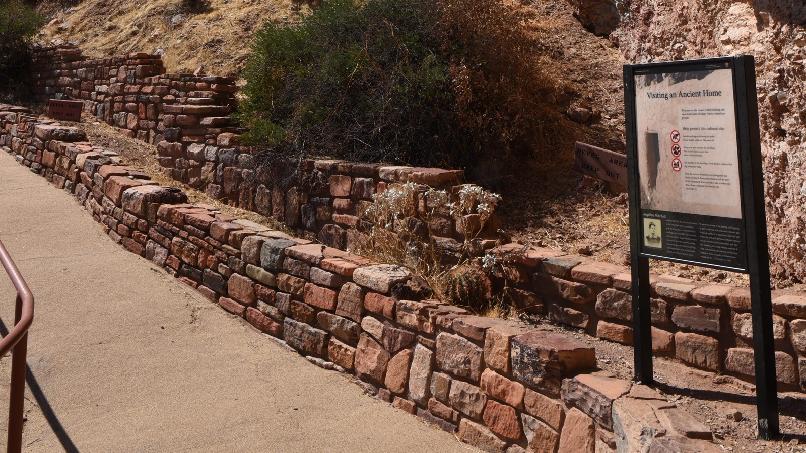 Visiting an Ancient Home Wayside by rock wall face 