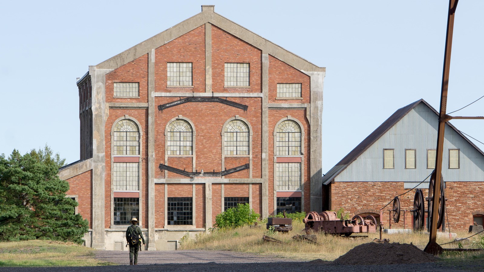 tall three-story brick building with six tall rectangular windows