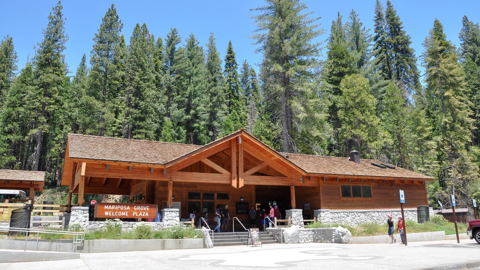 Wooden and stone building that houses the restrooms and Depot bookstore.