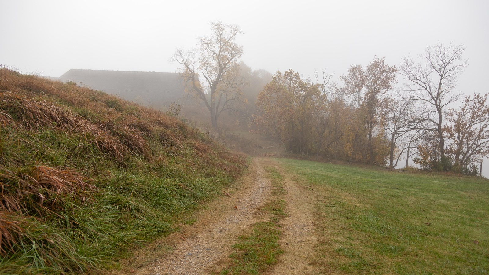 A trail into the woods following the shoreline. Downhill from a fort