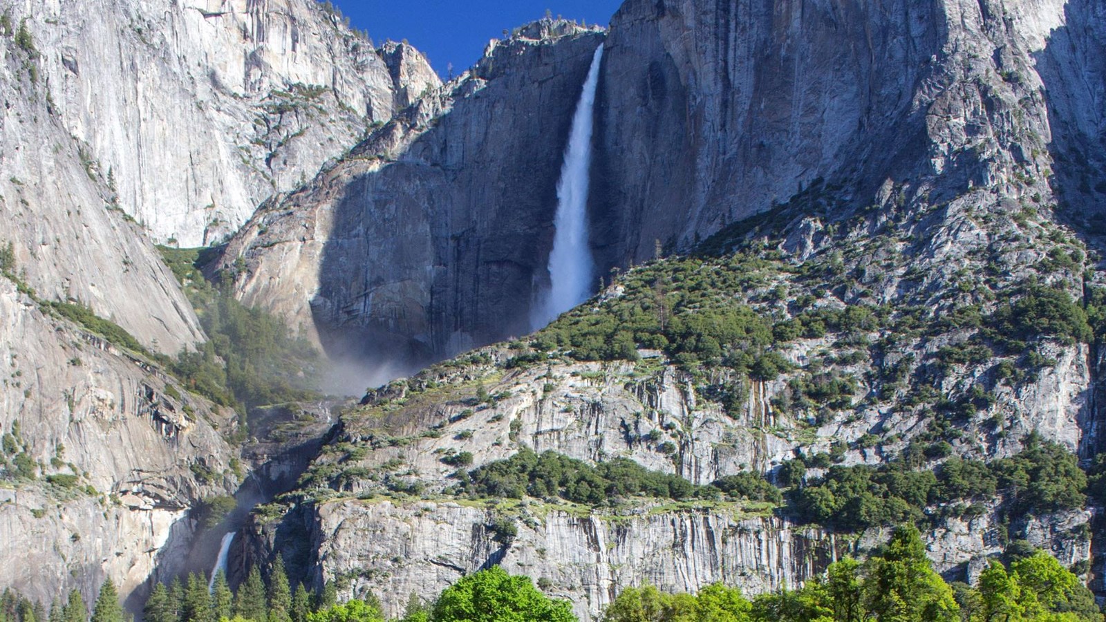 View of Yosemite Falls from Cook\'s Meadow, blue skies and full water